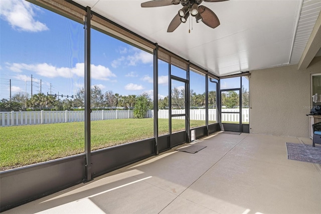 7750 Ridgelake Cir, Bradenton, FL 34203 - unfurnished sunroom with ceiling fan and a water view