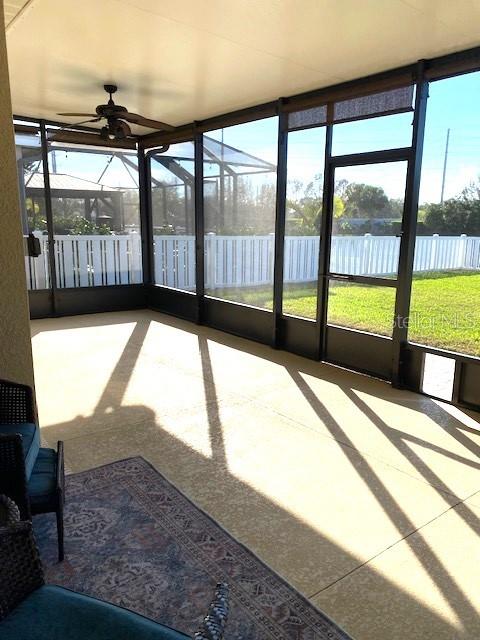 7750 Ridgelake Cir, Bradenton, FL 34203 - unfurnished sunroom with a ceiling fan and plenty of natural light
