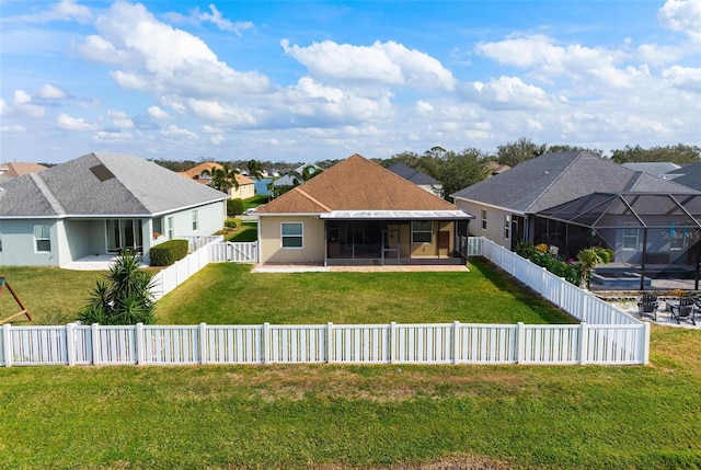 7750 Ridgelake Cir, Bradenton, FL 34203 - rear view of property featuring a sunroom, a residential view, a fenced backyard, and stucco siding