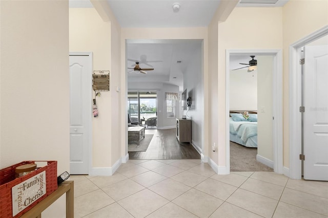 7750 Ridgelake Cir, Bradenton, FL 34203 - corridor featuring light tile patterned floors and baseboards