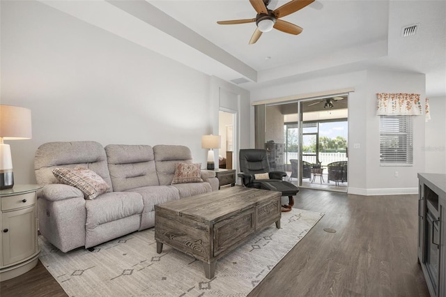 7750 Ridgelake Cir, Bradenton, FL 34203 - living room featuring ceiling fan, wood finished floors, and a tray ceiling