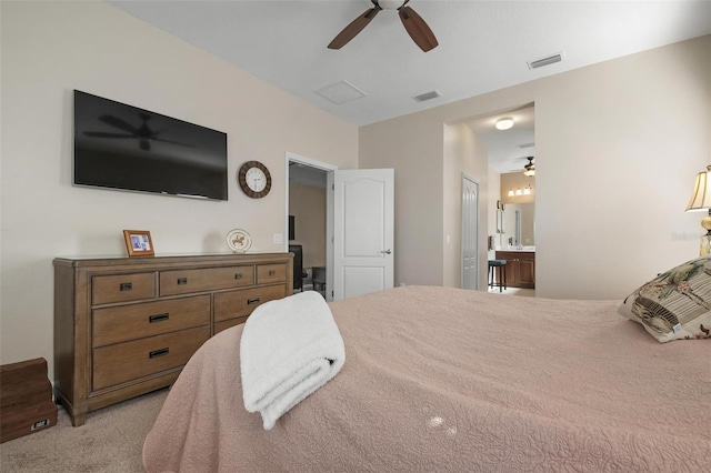 7750 Ridgelake Cir, Bradenton, FL 34203 - carpeted bedroom with ensuite bathroom and ceiling fan