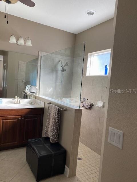 7750 Ridgelake Cir, Bradenton, FL 34203 - bathroom with tile patterned flooring, a walk in shower, vanity, and a ceiling fan