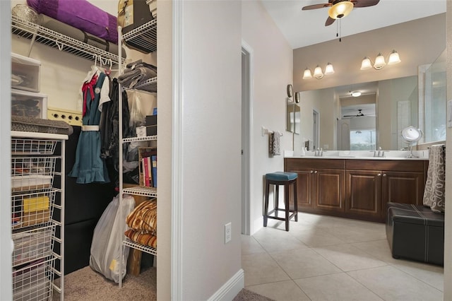 7750 Ridgelake Cir, Bradenton, FL 34203 - bathroom with ceiling fan, double vanity, tile patterned flooring, and a spacious closet
