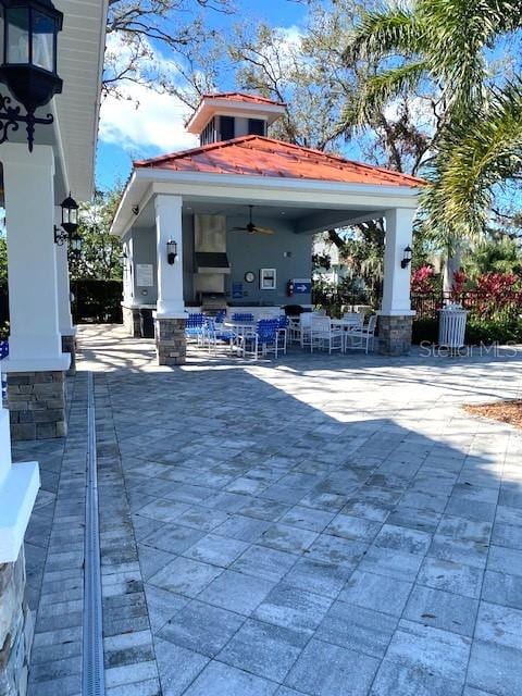 7750 Ridgelake Cir, Bradenton, FL 34203 - view of patio / terrace featuring ceiling fan and a gazebo