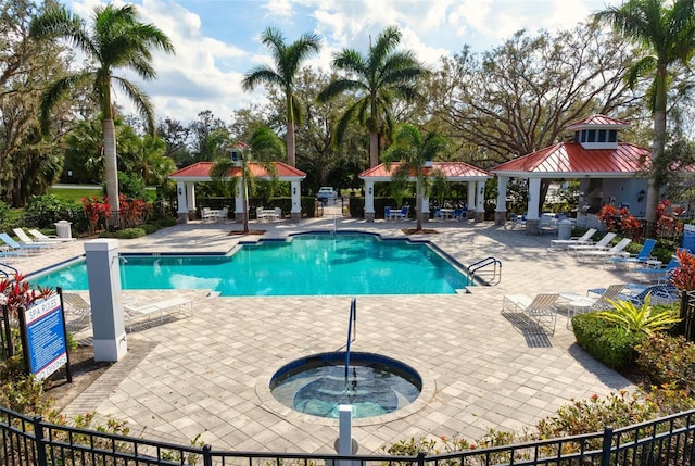7750 Ridgelake Cir, Bradenton, FL 34203 - community pool featuring a gazebo, a hot tub, and a patio area