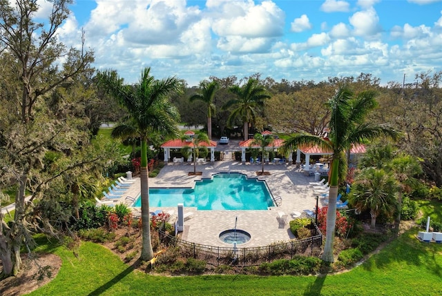 7750 Ridgelake Cir, Bradenton, FL 34203 - community pool with a community hot tub, a gazebo, a patio, and view of scattered trees