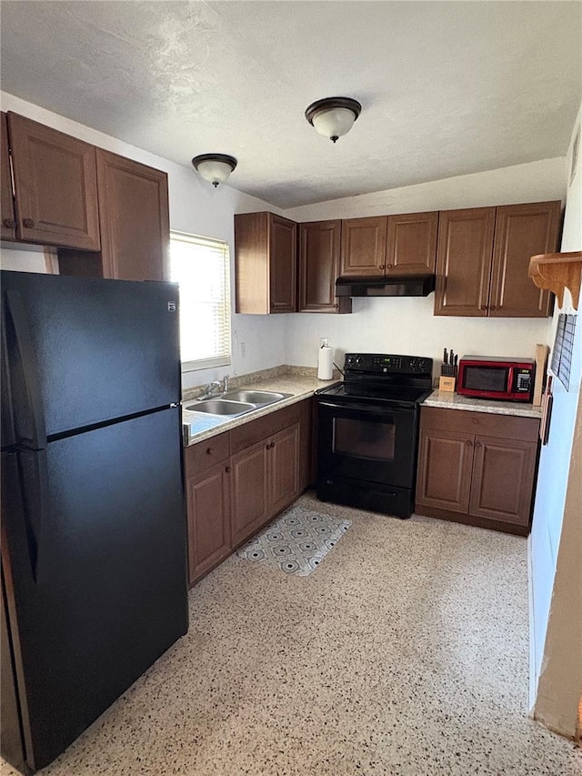 1224 38th St W, Bradenton, FL 34205 - kitchen featuring black appliances, light countertops, and under cabinet range hood