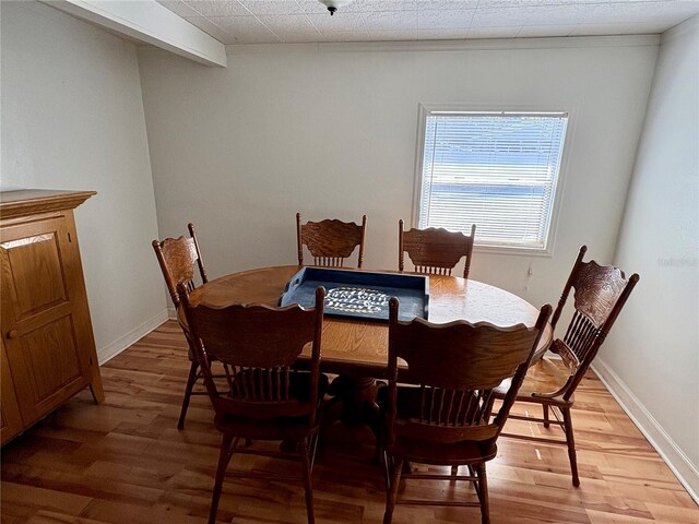 1224 38th St W, Bradenton, FL 34205 - dining room featuring light wood-type flooring and baseboards