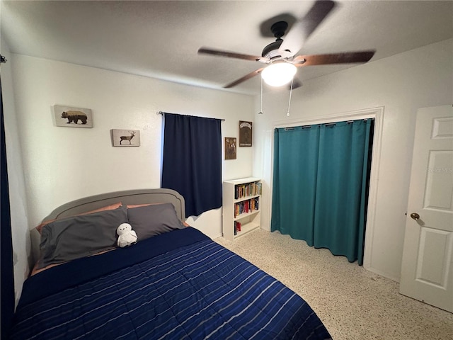 1224 38th St W, Bradenton, FL 34205 - bedroom with speckled floor, a ceiling fan, and a closet