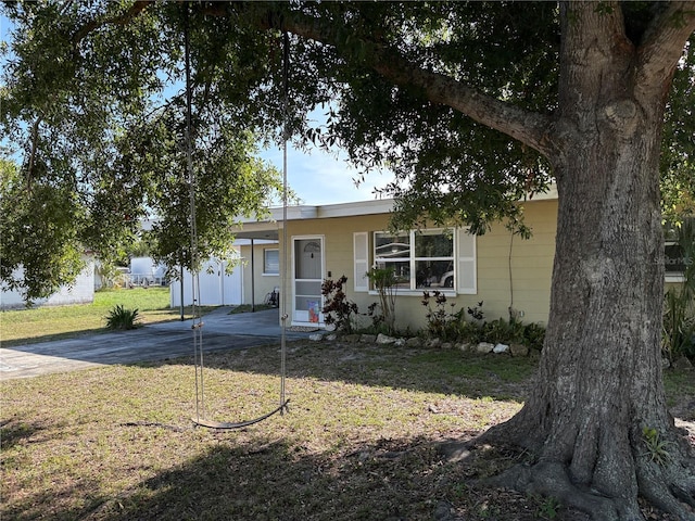 1224 38th St W, Bradenton, FL 34205 - view of front of home featuring concrete driveway, a front lawn, and an attached carport