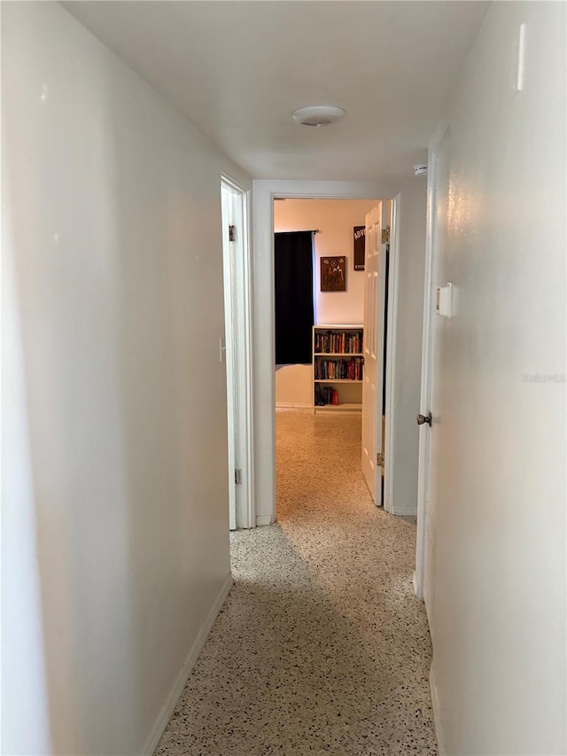 1224 38th St W, Bradenton, FL 34205 - corridor with baseboards and speckled floor