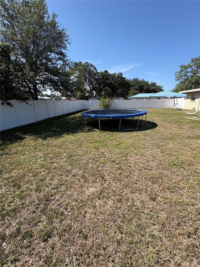 1224 38th St W, Bradenton, FL 34205 - fenced backyard featuring a trampoline