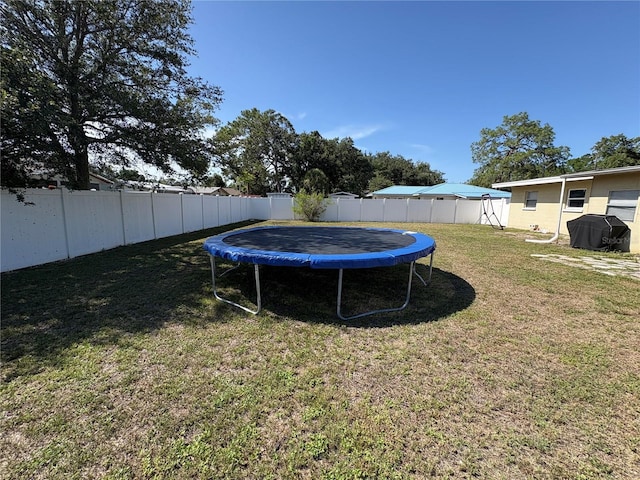 1224 38th St W, Bradenton, FL 34205 - fenced backyard with a trampoline
