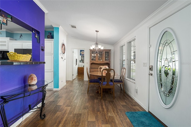 6710 36th Ave E Unit 114, Palmetto, FL 34221 - foyer with dark wood-style flooring, a chandelier, ornamental molding, and lofted ceiling