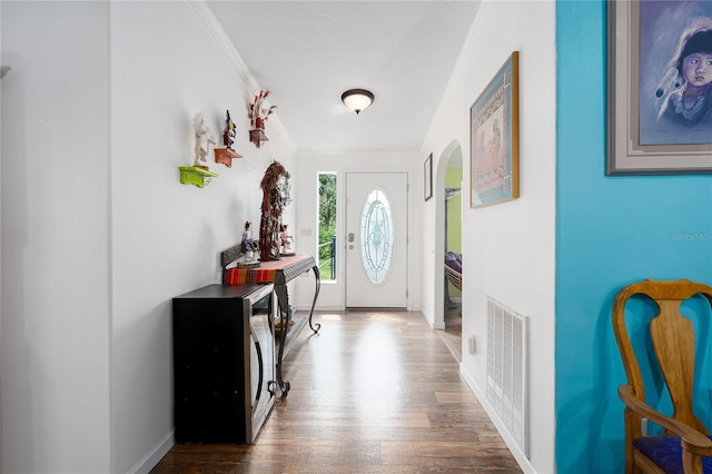6710 36th Ave E Unit 114, Palmetto, FL 34221 - foyer entrance with crown molding, wood finished floors, and arched walkways