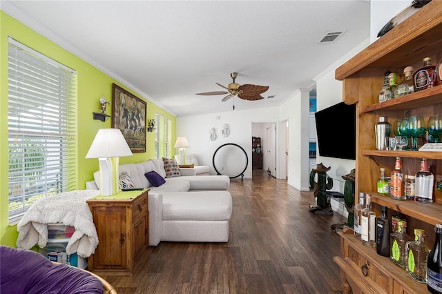 6710 36th Ave E Unit 114, Palmetto, FL 34221 - living area with a ceiling fan, a bar, ornamental molding, and dark wood finished floors
