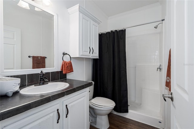 6710 36th Ave E Unit 114, Palmetto, FL 34221 - bathroom with vanity, a stall shower, ornamental molding, and wood finished floors