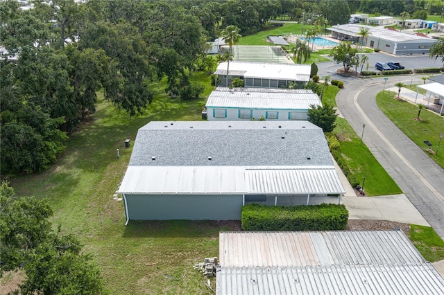 6710 36th Ave E Unit 114, Palmetto, FL 34221 - aerial view of property and surrounding area featuring a pool area