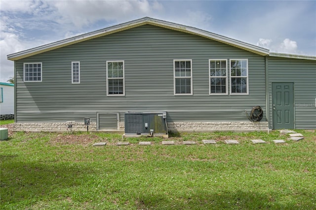 6710 36th Ave E Unit 114, Palmetto, FL 34221 - rear view of house with a yard