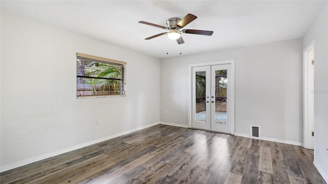 3525 Riviera Dr, Sarasota, FL 34232 - spare room with french doors, healthy amount of natural light, wood finished floors, and ceiling fan