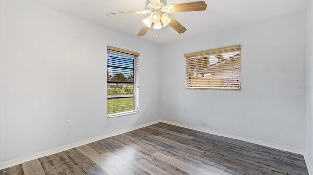 3525 Riviera Dr, Sarasota, FL 34232 - spare room with wood finished floors and ceiling fan
