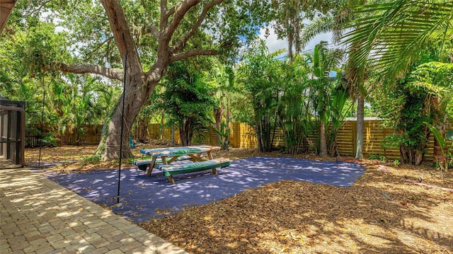3525 Riviera Dr, Sarasota, FL 34232 - fenced backyard with a patio area