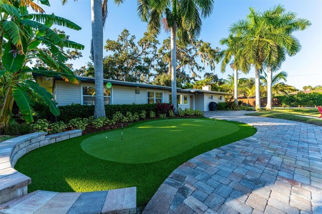 5311 36th Ave E, Palmetto, FL 34221 - view of front of home featuring a putting green and curved driveway