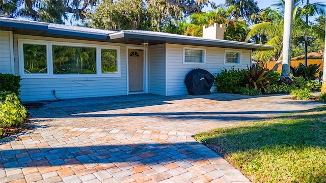 5311 36th Ave E, Palmetto, FL 34221 - view of front facade with a chimney