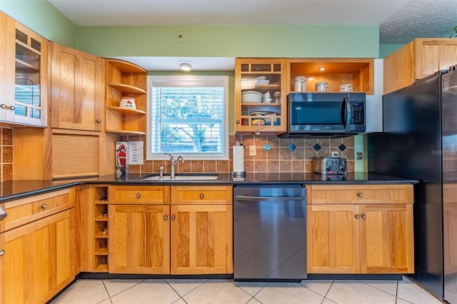 5311 36th Ave E, Palmetto, FL 34221 - kitchen with black appliances, open shelves, tasteful backsplash, and dark countertops