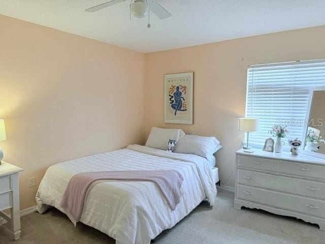 1959 Toucan Way Unit 206, Sarasota, FL 34232 - bedroom with light carpet and a ceiling fan