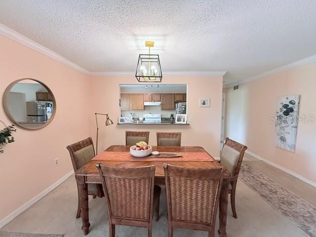 1959 Toucan Way Unit 206, Sarasota, FL 34232 - dining area with ornamental molding and a textured ceiling