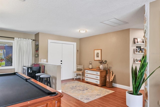 3636 Torrey Pines Blvd, Sarasota, FL 34238 - playroom featuring wood finished floors, billiards table, and a textured ceiling