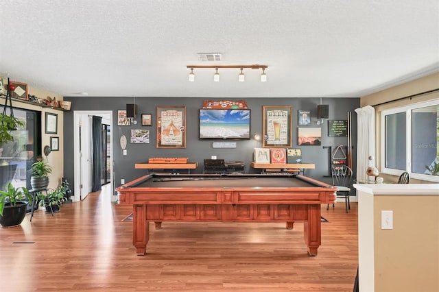 3636 Torrey Pines Blvd, Sarasota, FL 34238 - recreation room with pool table, light wood-style flooring, and a textured ceiling