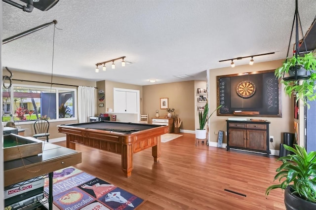 3636 Torrey Pines Blvd, Sarasota, FL 34238 - game room with rail lighting, a textured ceiling, wood finished floors, and billiards