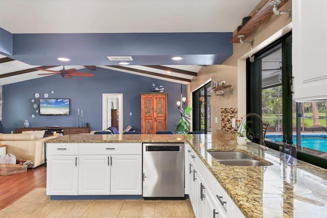 3636 Torrey Pines Blvd, Sarasota, FL 34238 - kitchen with dishwasher, a peninsula, open floor plan, white cabinetry, and recessed lighting