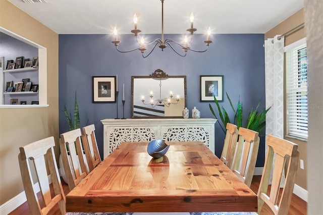 3636 Torrey Pines Blvd, Sarasota, FL 34238 - dining area with a chandelier and wood finished floors