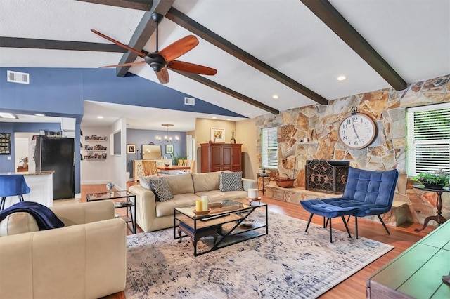 3636 Torrey Pines Blvd, Sarasota, FL 34238 - living room featuring light wood-style floors, a ceiling fan, healthy amount of natural light, and a chandelier