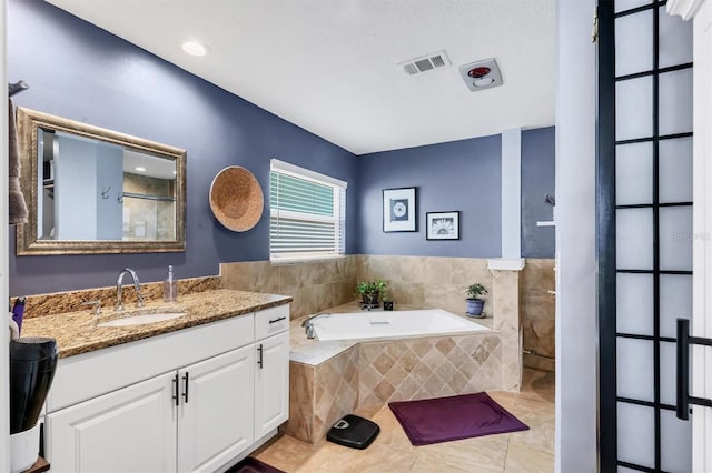3636 Torrey Pines Blvd, Sarasota, FL 34238 - bathroom featuring a garden tub, vanity, tiled shower, and tile patterned flooring