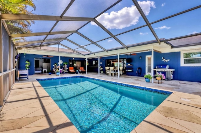 3636 Torrey Pines Blvd, Sarasota, FL 34238 - outdoor pool with a ceiling fan, a grill, a patio area, and glass enclosure