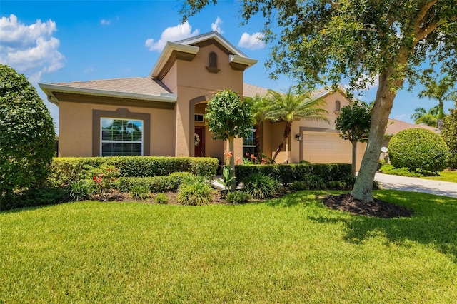 773 Rosemary Cir, Bradenton, FL 34212 - view of front of house with stucco siding, a front lawn, and an attached garage
