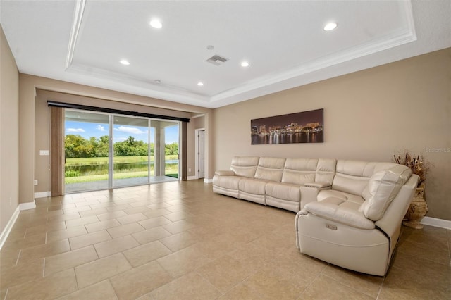 773 Rosemary Cir, Bradenton, FL 34212 - living room with a tray ceiling, recessed lighting, crown molding, and light tile patterned floors