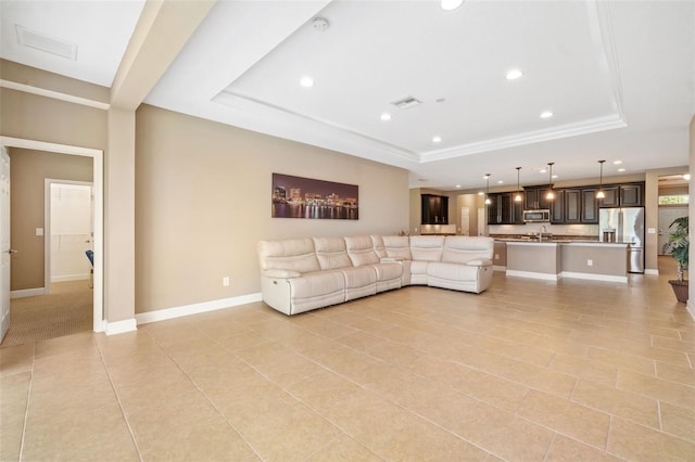 773 Rosemary Cir, Bradenton, FL 34212 - living area with a raised ceiling, recessed lighting, and light tile patterned floors
