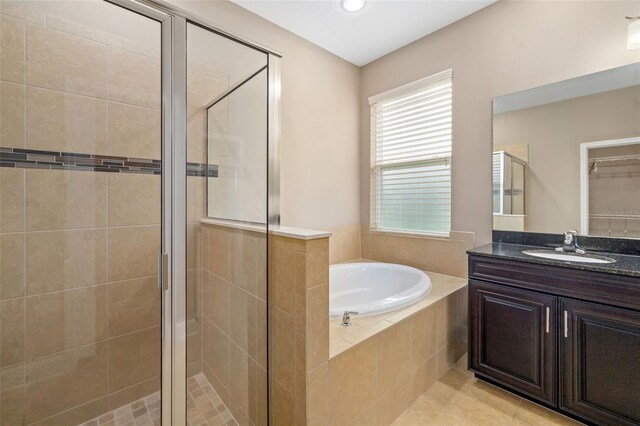 773 Rosemary Cir, Bradenton, FL 34212 - bathroom featuring a stall shower, a garden tub, vanity, healthy amount of natural light, and recessed lighting
