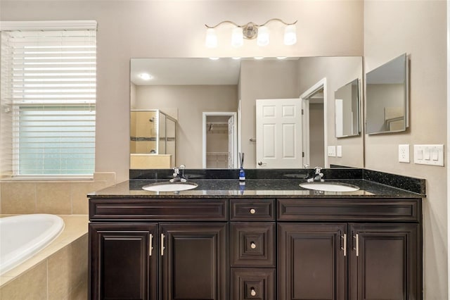 773 Rosemary Cir, Bradenton, FL 34212 - bathroom featuring a garden tub, double vanity, and a tile shower