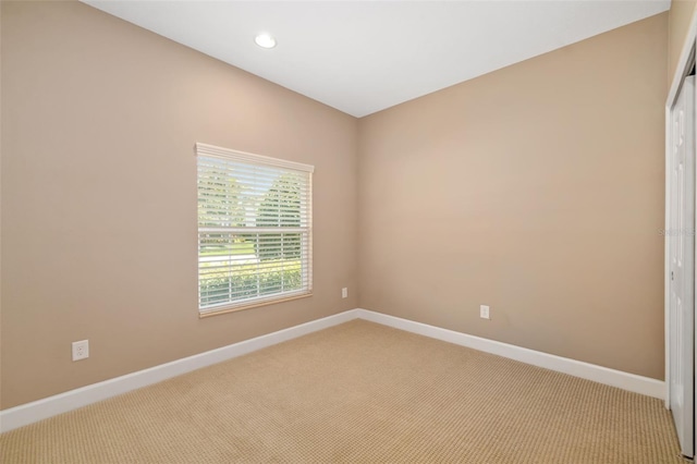 773 Rosemary Cir, Bradenton, FL 34212 - spare room featuring light carpet and recessed lighting