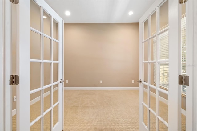 773 Rosemary Cir, Bradenton, FL 34212 - empty room featuring french doors, light carpet, and recessed lighting