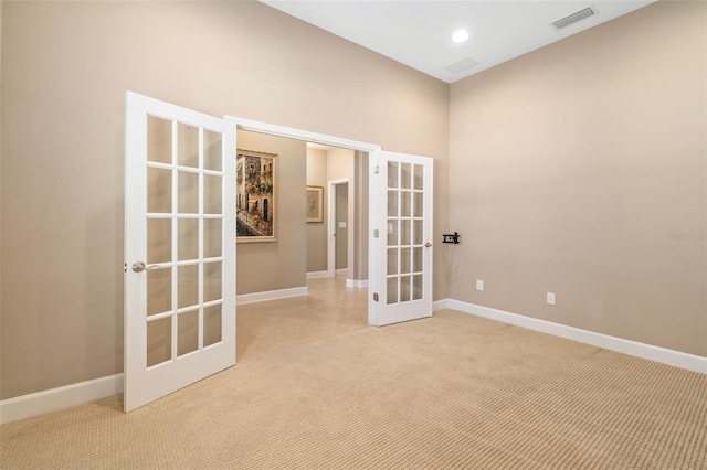 773 Rosemary Cir, Bradenton, FL 34212 - unfurnished room with french doors, light colored carpet, and recessed lighting