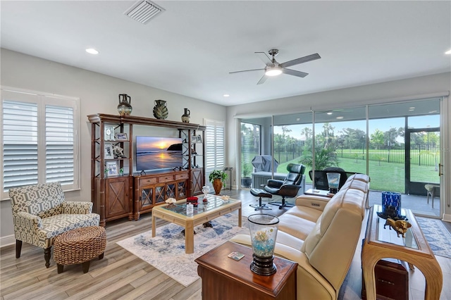 6219 Golden Nettle Dr, Apollo Beach, FL 33572 - living area with ceiling fan, light wood finished floors, and recessed lighting