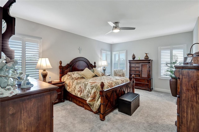 6219 Golden Nettle Dr, Apollo Beach, FL 33572 - bedroom with light colored carpet, multiple windows, and ceiling fan